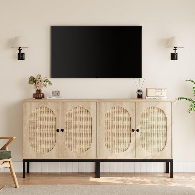 Wide view of a long light wood cabinet with four arched rattan panel doors beneath a wall-mounted TV