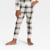 Toddler Plaid Ribbed Long Sleeve Shirt and Pants Holiday Matching Family Pajama Set - Wondershop™ Cream - 4 of 4