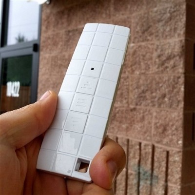 Ivory Motorized Retractable Patio Awning with White Frame