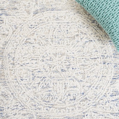 Ivory and Blue Handmade Wool Abstract Tufted Area Rug, 8' x 10'