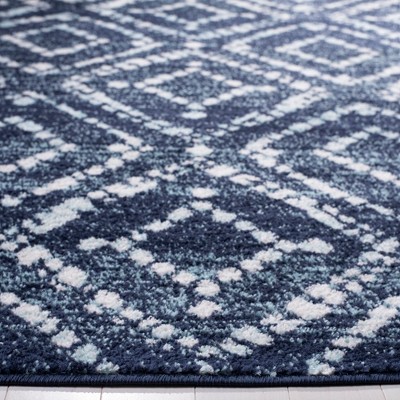 Navy and Ivory Geometric 4' x 6' Synthetic Area Rug