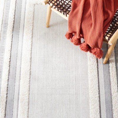 Ivory Synthetic 8' x 10' Easy-Care Indoor/Outdoor Area Rug