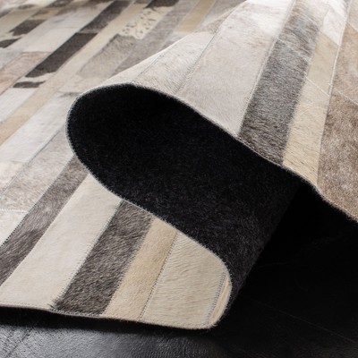 Handmade Geometric Gray Cowhide Accent Rug - 27" x 7"