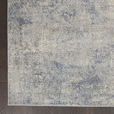 Ivory Elegance 5'3" x 7'3" Synthetic Vintage Persian Rug