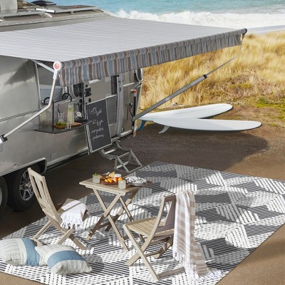 Black and Ivory Geometric 4' x 6' Synthetic Area Rug