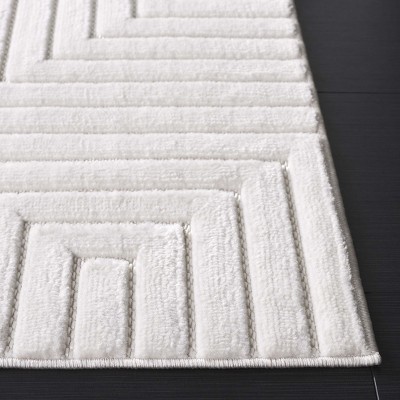 Ivory Geometric Synthetic Rectangular Area Rug 5'3" x 7'6"