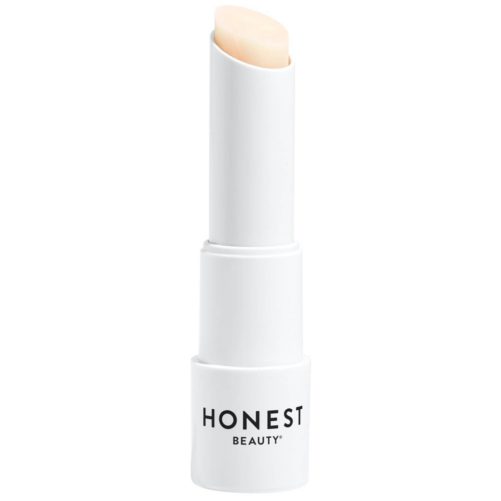 white lip balm container with black text