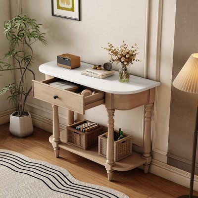 Narrow console table viewed from an oblique angle with one open drawer