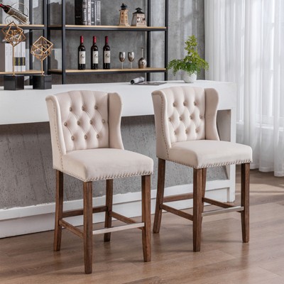 Velvet Counter Height Bar Stool, Upholstered 27" Seat Height, Wingback Breakfast Chair with Nailhead Trim and Tufted Back, Wood Legs, Set of 2 Beige