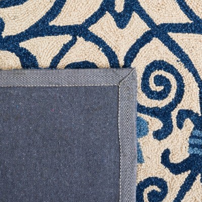 Ivory and Dark Blue Handmade Wool 6' x 9' Area Rug