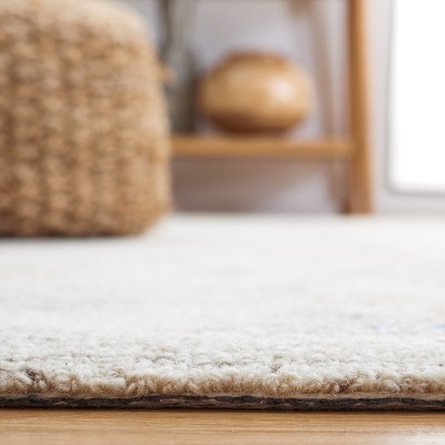 Handmade Blue and Ivory Wool 4' x 6' Tufted Area Rug