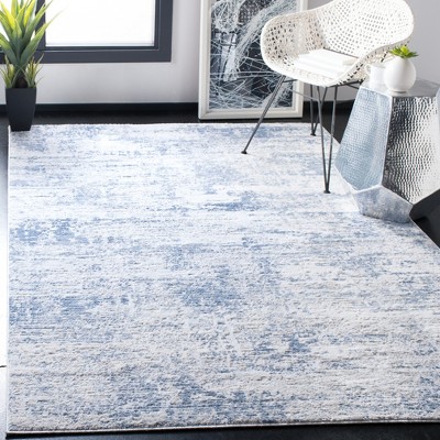 Ivory and Blue Abstract Round Synthetic Area Rug
