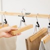 SONGMICS 12 Pack Wooden Pants Hangers Solid Wood with Non-Slip Felt Hold Pants Tightly Smooth Finish Wood Skirt Hangers Natural - 3 of 4