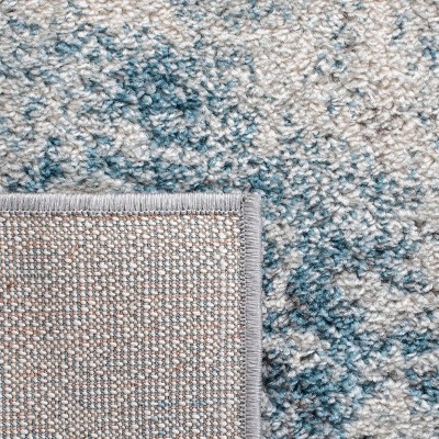Boho-Chic Ivory/Blue Synthetic 9' x 12' Reversible Area Rug