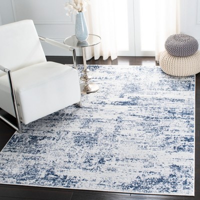 Ivory and Navy Abstract Synthetic Round Rug, 4' x 6'
