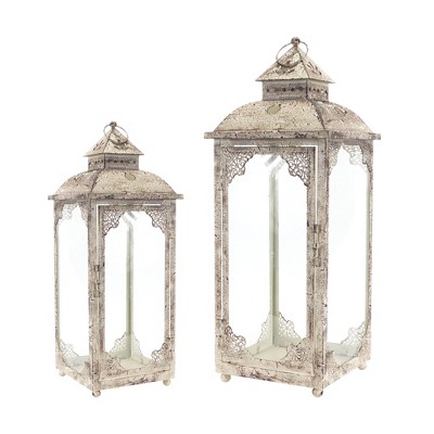 HomeRoots Set of Two Beige Distressed Ornate Glass And Metal Floor Lantern Candle Holders