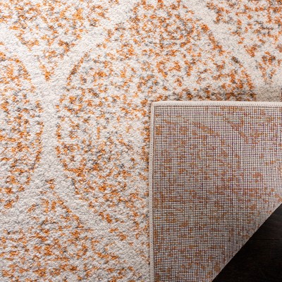 Ivory and Orange Synthetic Stain-Resistant Area Rug 3' x 5'