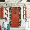 6-foot pre-lit Christmas wreath adorned with pine cones, berries, poinsettias, bows, and spherical ornaments, with 20 warm white lights. - 3 of 4