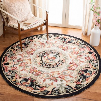 Handmade Ivory and Black Floral Wool Round Rug