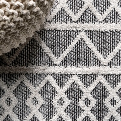 Aylan Black/Ivory Geometric High-Low Pile Synthetic Indoor/Outdoor Rug