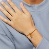Free bird Cross Birthstone Bracelet | Dainty 14K Gold Plated Cross Charm Bracelet | Stretchable Elastic Gold Beaded Bracelet - 3 of 4
