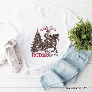 Annual North Pole Rodeo T-Shirt, Funny Cowboy Santa Christmas Tee for Country Lovers| OrnamentallyYou - 1 of 4