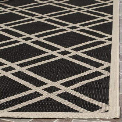 Safavieh Courtyard 5'3" x 7'7" Black and Beige Synthetic Area Rug