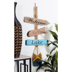 Wooden Paddle Novelty Canoe Oar Sign Wall Decor with Arrow and Stripe Patterns Multi Colored - Olivia & May - 1 of 4