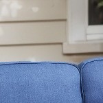 brown wicker/blue cushion