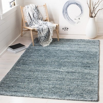 Handmade Himalaya Tufted Blue Wool Rectangular Rug - 5' x 8'