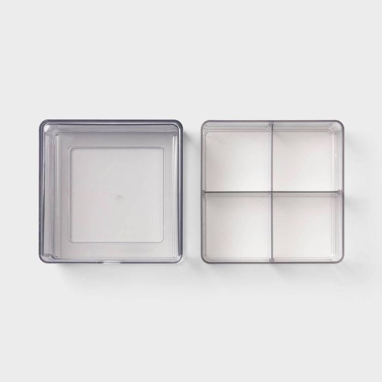 Two clear square storage containers, one with a single compartment and the other divided into four sections, placed side by side on a white background.