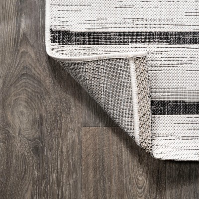 Ivory and Black Striped Synthetic 4' x 6' Indoor/Outdoor Rug