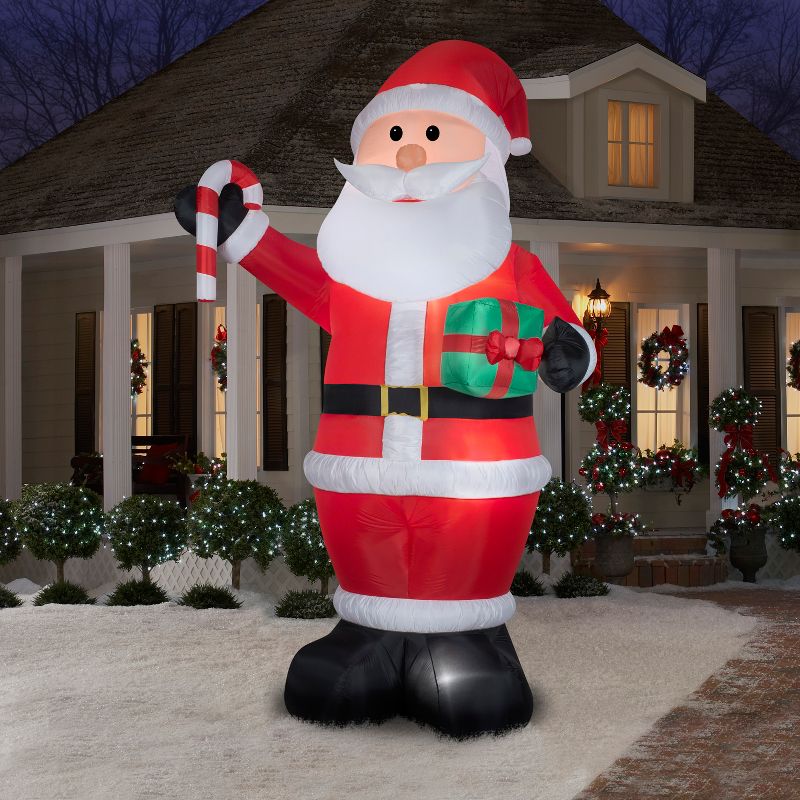 Gemmy Christmas Airblown Inflatable Santa w/Gift and Candy Cane Giant, 12 ft Tall, Multicolored, 2 of 5