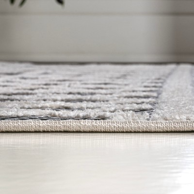 Aylan Black/Ivory Geometric High-Low Pile Synthetic Indoor/Outdoor Rug