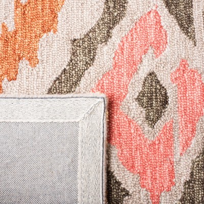 Handmade Red Ikat Wool Tufted Area Rug