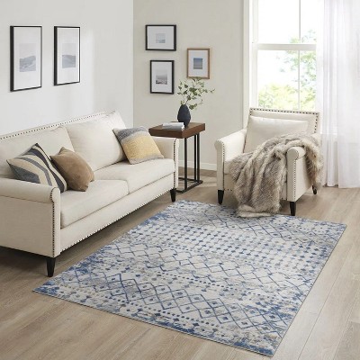 LunaLulink The blue and cream woven rug is easy to clean and stain and fade resistant.