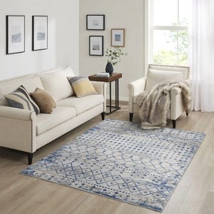 LunaLulink The blue and cream woven rug is easy to clean and stain and fade resistant. - 1 of 4