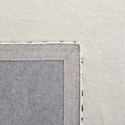 Ivory and Black Rectangular Wool Tufted Area Rug 8' x 10'
