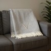 HomeRoots 55" X 70" Gray And White Herringbone Cotton Blend V Initial Throw Blanket with Tassels And Embroidery - 2 of 4