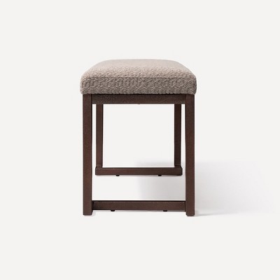 Front view of stool-like bench showing leg structure