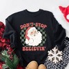 Simply Sage Market Women's Graphic Sweatshirt Don't Stop Believin' Santa Checkered - 3 of 4