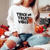 Simply Sage Market Women's Graphic Sweatshirt Trick Or Treat Vibes Pumpkin - 2 of 4