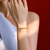 Free bird Cross Birthstone Bracelet | Dainty 14K Gold Plated Cross Charm Bracelet | Stretchable Elastic Gold Beaded Bracelet - 2 of 4