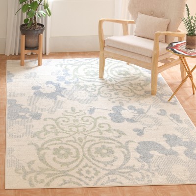 Ivory and Blue Floral Synthetic 6' x 9' Area Rug