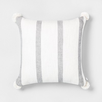 grey and white striped pillow