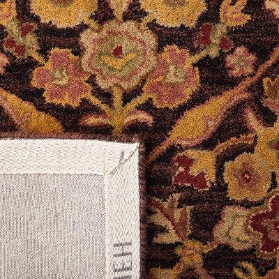 Antiquity Hand Tufted Wool Area Rug in Dark Plum and Gold