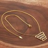 ELYA Women's Tiered Geometric Gold Plated Steel Necklace - 3 of 3