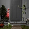 Glow in the Dark Skull with Hands Halloween Decorative Prop - Hyde and EEK! Boutique™: Antique Finish, Indoor/Outdoor Use - 2 of 3