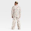 Men's Grinch Print Long Sleeve Shirt and Pants Holiday Matching Family Pajama Set - Cream - 2 of 4