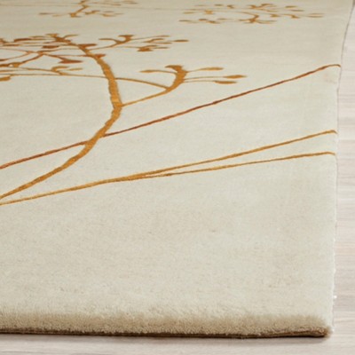 Ivory and Orange Hand-Tufted Wool Area Rug